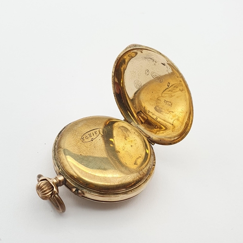 255 - A continental Lady's Fob Watch, the white enamel dial having Roman numerals and Louis XVI gold hands... 