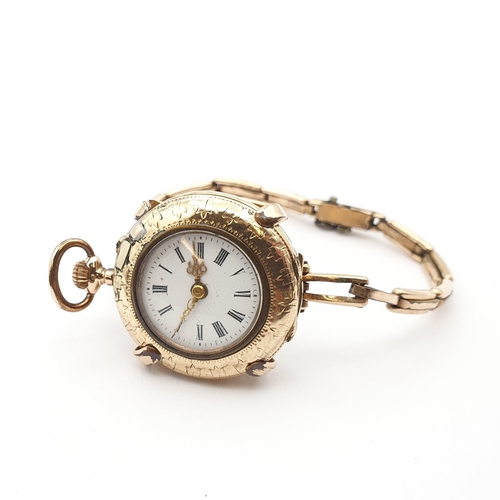 255 - A continental Lady's Fob Watch, the white enamel dial having Roman numerals and Louis XVI gold hands... 