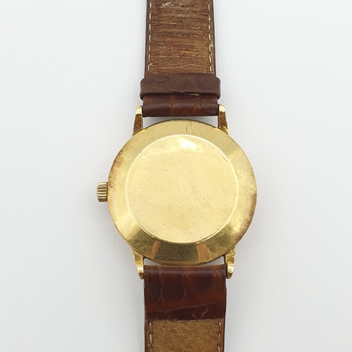 260 - An Omega gentleman's automatic Wristwatch, the textured champagne enamel dial with gold-coloured app... 