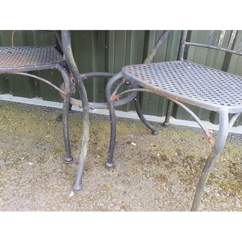 827 - A Garden Table with reconstituted top on metal base and two garden Chairs