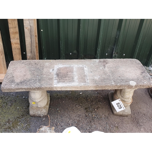 829 - A reconstituted Garden Bench, the supports modelled as rabbits