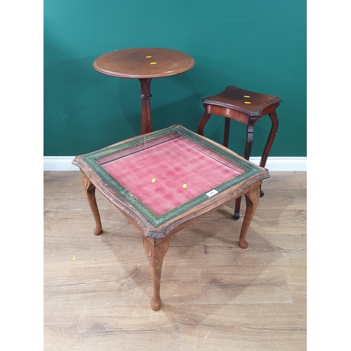 412 - A circular topped Tripod table, a two tier side table and a square topped coffee display table and a... 