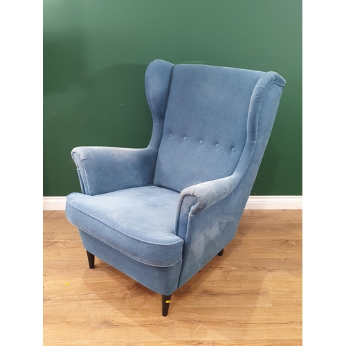 414 - A blue upholstered Ikea wingback armchair. (R4)