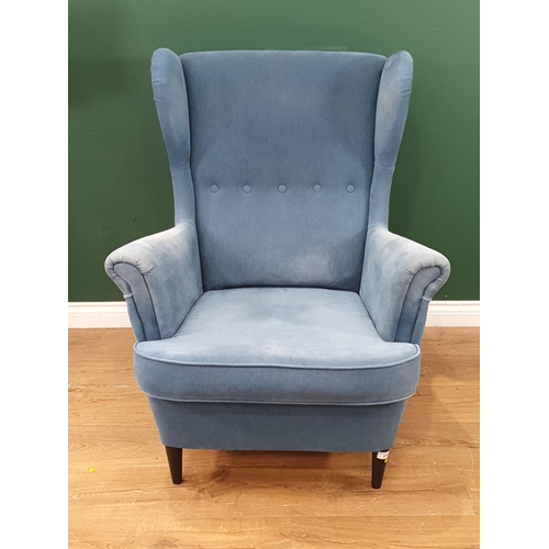 414 - A blue upholstered Ikea wingback armchair. (R4)