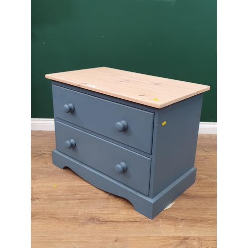 415 - A blue Chest of small proportions fitted two long drawers with shaped apron, 1ft 10