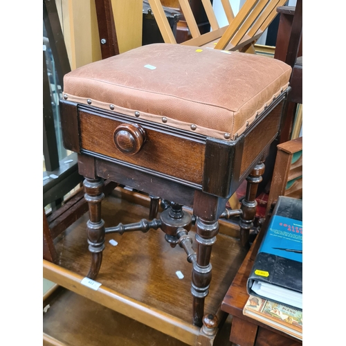 402 - A Mahogany upholstered footstool, a tea trolley, a miniature easel and a butlers tray stand. (R3)