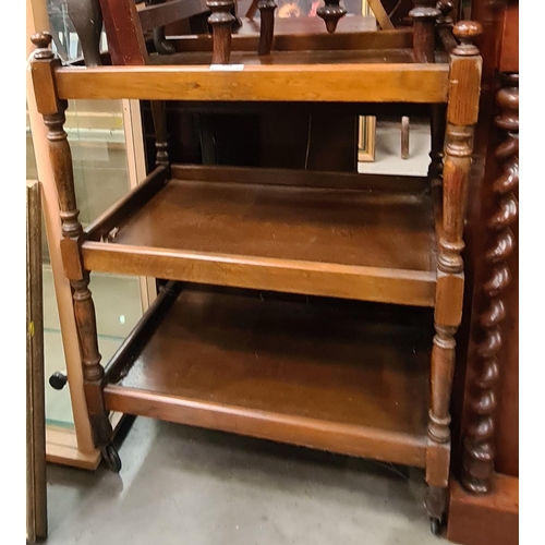 402 - A Mahogany upholstered footstool, a tea trolley, a miniature easel and a butlers tray stand. (R3)
