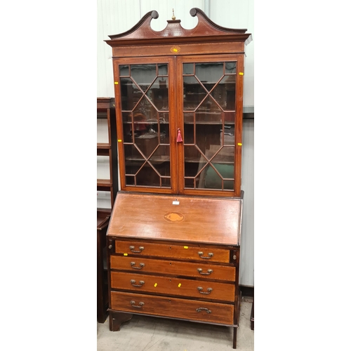 405 - A Mahogany and crossbanded glazed Bureau Bookcase, the base fitted four long drawers and single fall... 