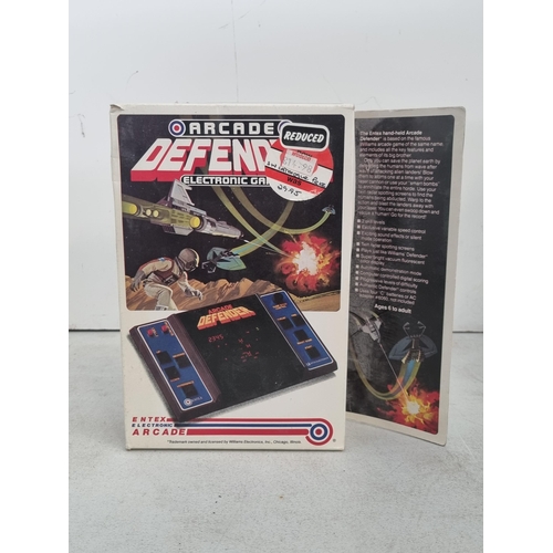 A boxed Entex Electronic Arcade Arcade Defender Electronic Game ...