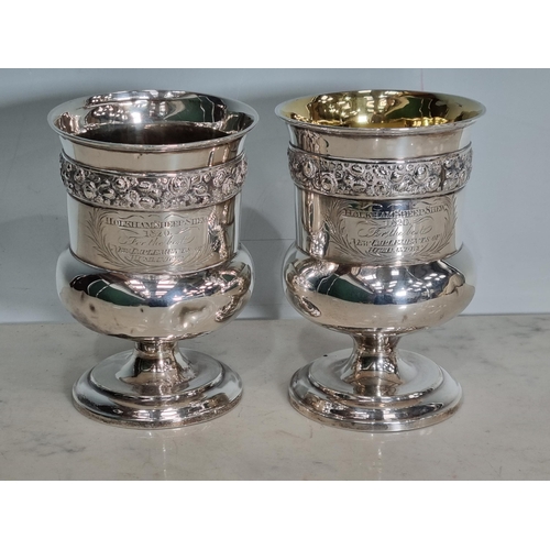 16 - A pair of George IV silver Goblets embossed floral friezes, engraved presentation inscription 'Holkh... 