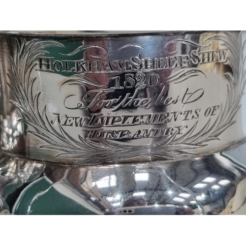 16 - A pair of George IV silver Goblets embossed floral friezes, engraved presentation inscription 'Holkh... 