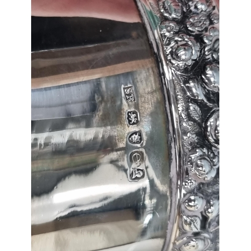 16 - A pair of George IV silver Goblets embossed floral friezes, engraved presentation inscription 'Holkh... 