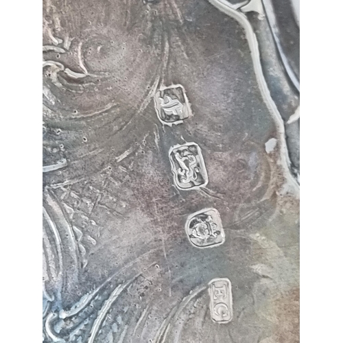 18 - A George III silver shaped circular Salver with leafage scroll engraving and scallop border, raised ... 