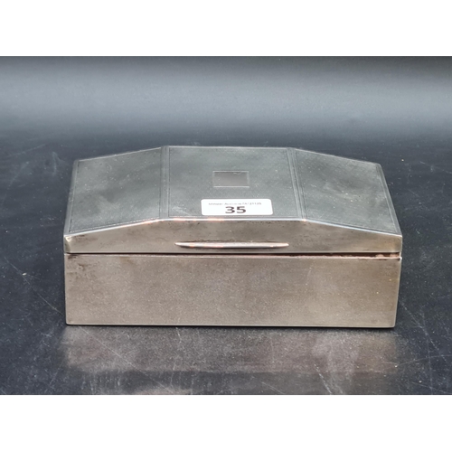 35 - A George V silver Cigarette Box with engine turned decoration, Birmingham 1927, 7 x 3 1/2in, total w... 