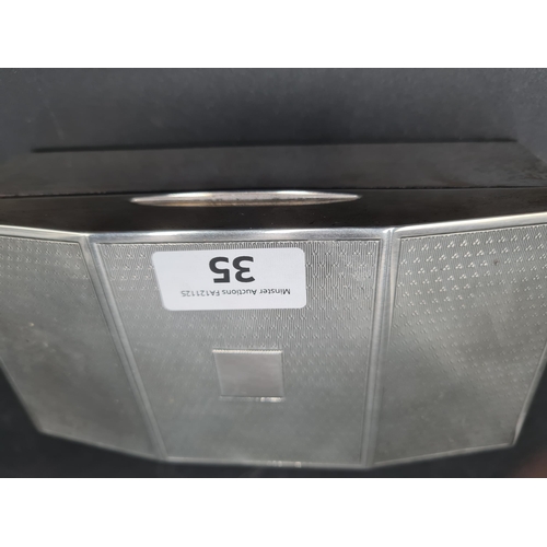 35 - A George V silver Cigarette Box with engine turned decoration, Birmingham 1927, 7 x 3 1/2in, total w... 