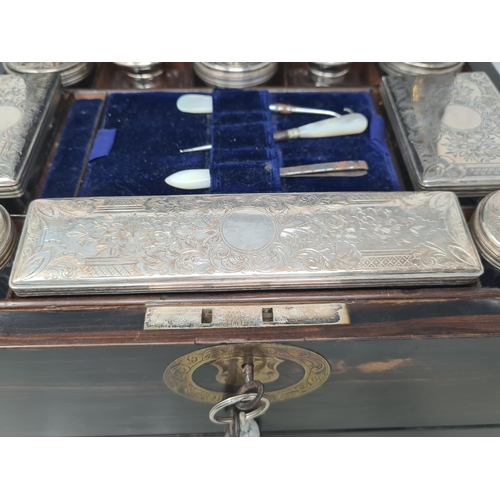 36 - An early 19th century coromandel Dressing case with brass mounts, cartouche and escutcheon, numerous... 