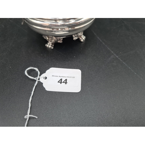 44 - A William IV silver circular Milk Jug with gadroon rim, leafage scroll handle on  paw feet, London 1... 