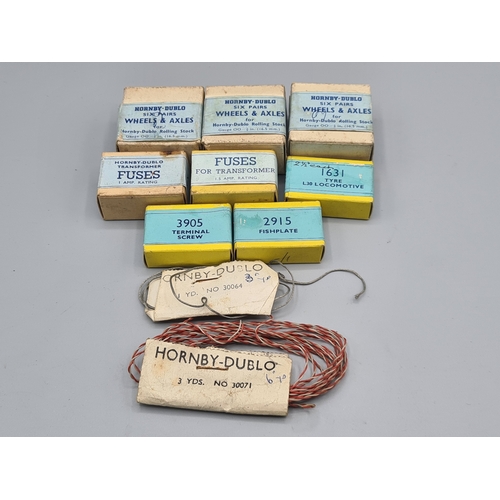 41 - Eight boxes of Hornby Dublo Spares including L30 traction tyres, 3x boxes metal wheels and axles, fi... 