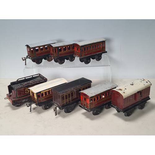 415 - Five assorted German tinplate 0 gauge LMS 4-wheel Coaches and two GWR 4-wheel Coaches, together with... 