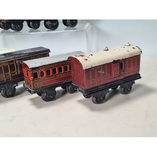 415 - Five assorted German tinplate 0 gauge LMS 4-wheel Coaches and two GWR 4-wheel Coaches, together with... 