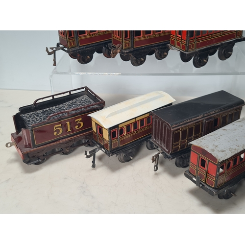 415 - Five assorted German tinplate 0 gauge LMS 4-wheel Coaches and two GWR 4-wheel Coaches, together with... 