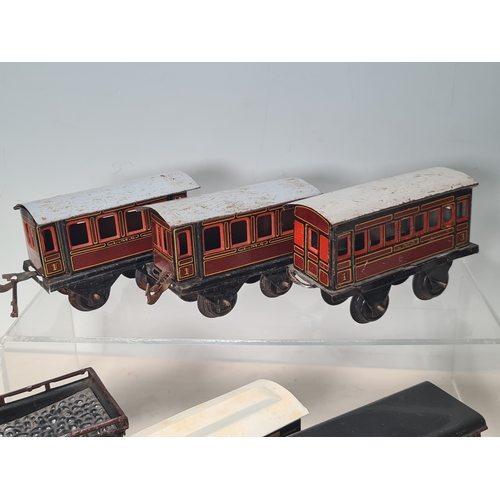 415 - Five assorted German tinplate 0 gauge LMS 4-wheel Coaches and two GWR 4-wheel Coaches, together with... 
