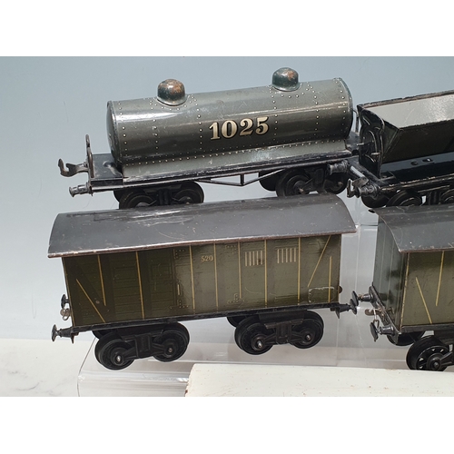 426 - Six Bing 0 gauge Bogie Wagons comprising 2x 520 Goods Vans, Milk Traffic Van, 1025 Tanker, Straw Fla... 