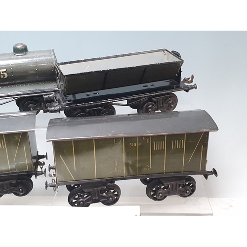 426 - Six Bing 0 gauge Bogie Wagons comprising 2x 520 Goods Vans, Milk Traffic Van, 1025 Tanker, Straw Fla... 