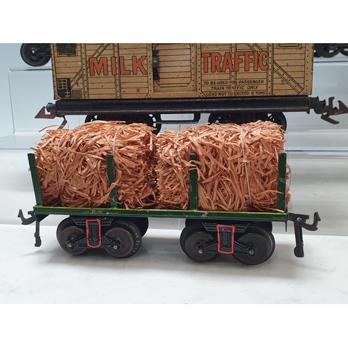 426 - Six Bing 0 gauge Bogie Wagons comprising 2x 520 Goods Vans, Milk Traffic Van, 1025 Tanker, Straw Fla... 