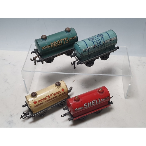 427 - Four Bing 0 gauge Tank Wagons comprising Shield's & Brown, Motor Shell Spirit, Motor BP Spirit and M... 