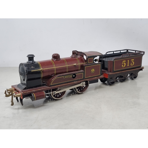 454 - A Bing 0 gauge clockwork LMS Maroon 0-4-0 Locomotive and tender 'Apollo' No.513, VG-Ex