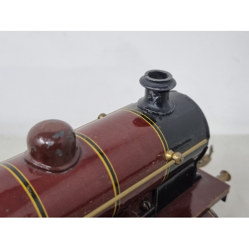 454 - A Bing 0 gauge clockwork LMS Maroon 0-4-0 Locomotive and tender 'Apollo' No.513, VG-Ex