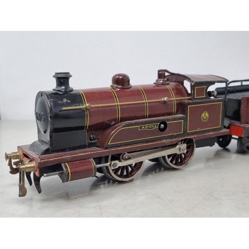 454 - A Bing 0 gauge clockwork LMS Maroon 0-4-0 Locomotive and tender 'Apollo' No.513, VG-Ex