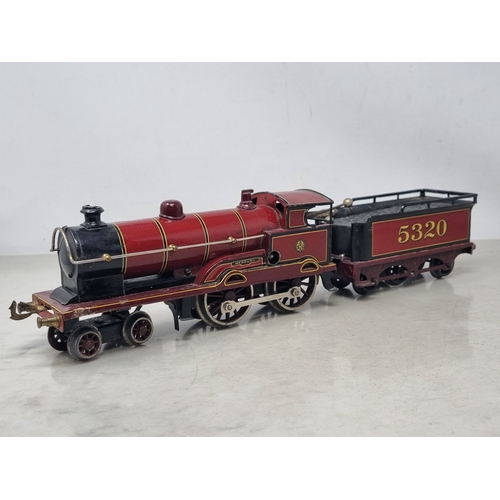 481 - A Bing 0 gauge clockwork LMS maroon 4-4-0 Locomotive and Tender 'Apollo', generally VG, appears in g... 