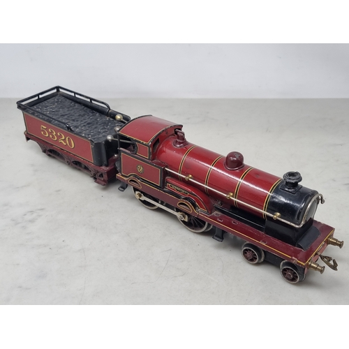 481 - A Bing 0 gauge clockwork LMS maroon 4-4-0 Locomotive and Tender 'Apollo', generally VG, appears in g... 