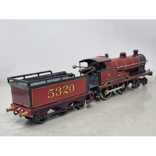 481 - A Bing 0 gauge clockwork LMS maroon 4-4-0 Locomotive and Tender 'Apollo', generally VG, appears in g... 