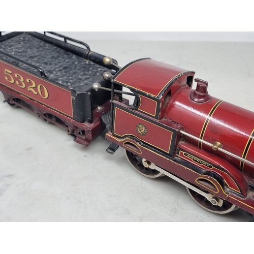 481 - A Bing 0 gauge clockwork LMS maroon 4-4-0 Locomotive and Tender 'Apollo', generally VG, appears in g... 