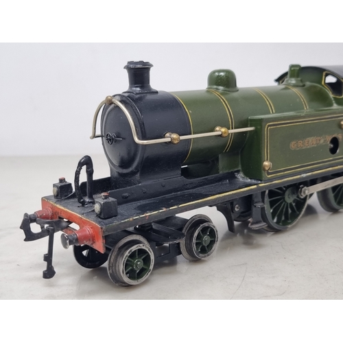 482 - A Bing 0 gauge clockwork Great Western green 4-4-0T Locomotive, generally VG, appears in good workin... 
