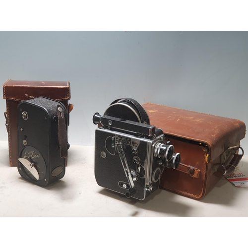 13 - A Paillard Bolex Cine Camera with accessories in leather case, and a Ensign Kinecam Model 4 Cine Cam... 