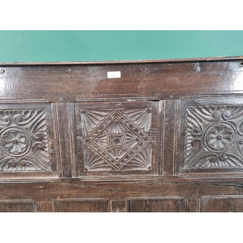 2 - An Oak headboard with three carved panels, (R7).