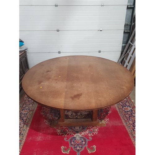27A - A large circular oak Dining Table with rectangular base having squared supports, 7ft diam, and a set... 