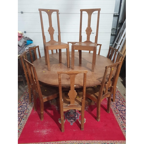 27A - A large circular oak Dining Table with rectangular base having squared supports, 7ft diam, and a set... 