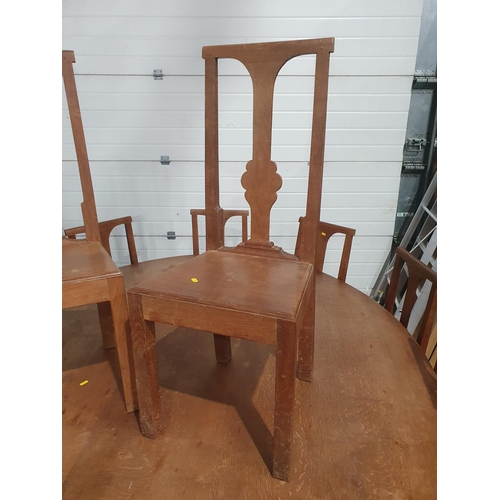 27A - A large circular oak Dining Table with rectangular base having squared supports, 7ft diam, and a set... 