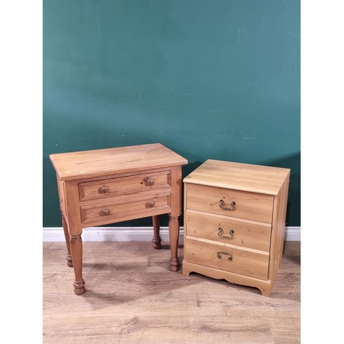 31 - A modern pine Bedside Table with panelled ends, with pair of fitted drawers and raised o turned and ... 