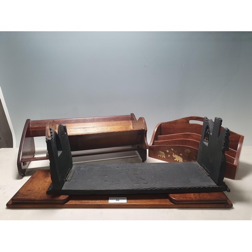 32 - An Irish bog oak Book Stand with folding ends in the form of castle walls, 18 1/2in W, another foldi... 