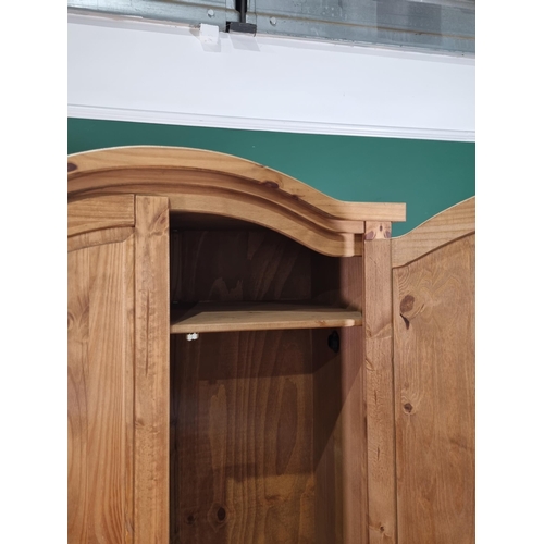 35 - A modern pine two door wardrobe, (R1).