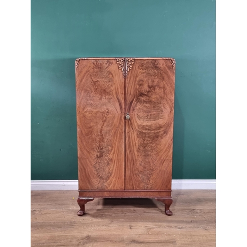 36 - A vintage walnut bedroom suite comprising of a mirror back dressing table, two door wardrobe and a b... 