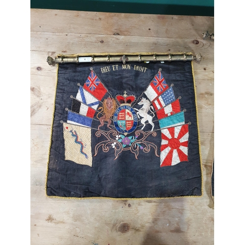 4 - A pair of embroided armorial crests, (R6).