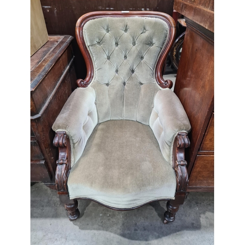 41 - A button upholstered Nursing Chair on carved and scrolled supports and castors. (R7).