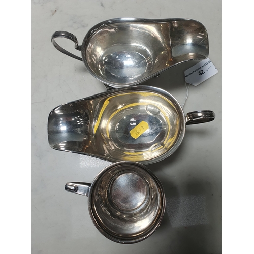 42 - A pair of George V silver Sauce Boats, with pad feet and engraved initials 'Birmingham 1924', and a ... 